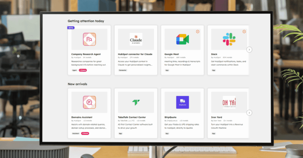 HubSpot App Marketplace showing featured integrations including Claude, Google Meet, Slack, and new app arrivals