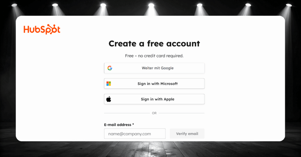 HubSpot free account signup page with Google, Microsoft, and Apple login options plus email verification